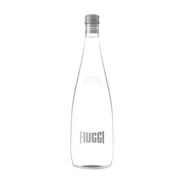 Fiuggi Natural Mineral Water clear glass bottle with silver screw cap, embossed logo near neck and Fiuggi name on front, sourced from volcanic deposits in Lazio, Italy, known for aiding kidney stone elimination and metabolic waste removal, also suitable for hydration and detoxification.