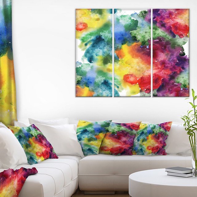 Design Art Impression sur Toile Abstrait à Texture Aquarelle Mettant en Vedette une Toile en Coton Enveloppée de Trois Panneaux Vibrants avec Éclaboussures d'Aquarelle en Jaune, Vert, Bleu, Rouge et Violet sur un sous-Cadre en Bois de 1 Po, Affichée au-Dessus d'Un sofa Sectionnel Blanc avec Coussins Décoratifs Multicolores Assortis, Convient pour Rehausser la Déco Moderne de la Maison.