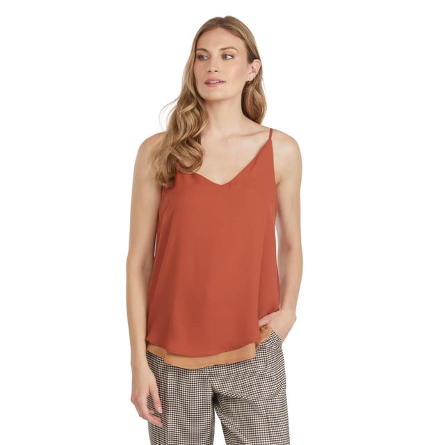 Mexx Women’s Two-Toned Reversible V-Neck Tank Top shown front-facing on a model wearing a brown and beige two-tone sleeveless summer top with thin shoulder straps and a V neckline, paired with black and white checkered pants, ideal for casual summer outfits.
