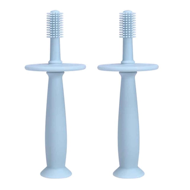 Set of 2 silicone baby toothbrushes with suction base and choke guard, shown in blue. Each toothbrush features a 360-degree rotating brush head, a removable flow-blocking protection baffle, and a soft silicone texture for safe and effective cleaning. Designed for children aged 1-6 years, these toothbrushes promote good oral hygiene and are suitable for both incisors and back teeth. The suction base ensures stability when not in use.
