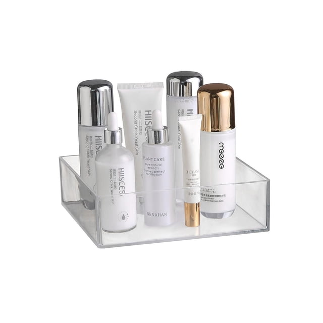 Mainstays Clear Stackable Organizer 3 holding six assorted white and silver cosmetic bottles and tubes, shown front-facing on a white background, made of transparent plastic with a slim rectangular design ideal for organizing bathroom toiletries and saving vanity space, also suitable for storing office supplies or accessories.