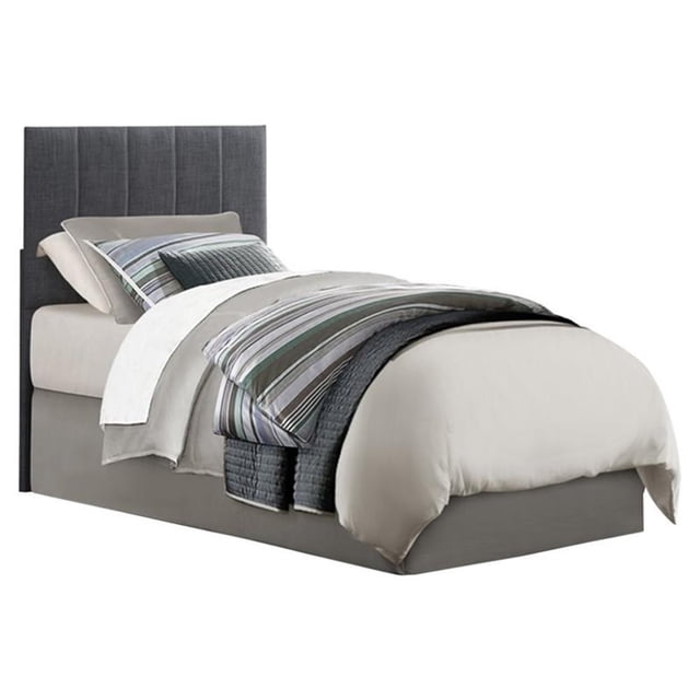 Lexicon Potrero Twin Upholstered Panel Headboard in Gray, featuring a dark gray fabric with vertical channel tufting. The headboard is crafted with an engineered wood frame and wrapped in soft 100% polyester fabric for a modern look. Ideal for bedroom furniture setups, it includes hardware for easy installation and requires adult assembly. Dimensions: 48.25 inches high, 40.50 inches wide, and 2.25 inches deep.