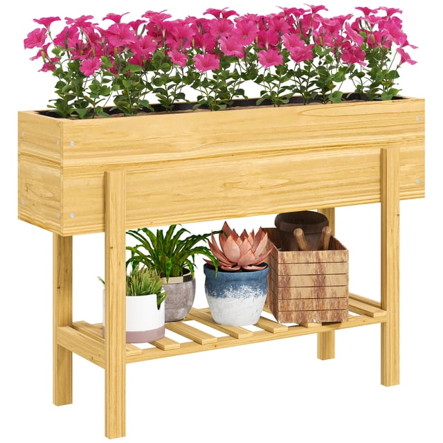 Outsunny Raised Garden Bed, Planter Box with Storage Shelf in natural wood. The top vegetable garden box is filled with vibrant pink flowers, while the bottom slatted shelf holds gardening tools and potted plants. Constructed from fir wood, it features dual drainage holes and a non-woven lining for soil freshness and durability, ideal for outdoor gardening.