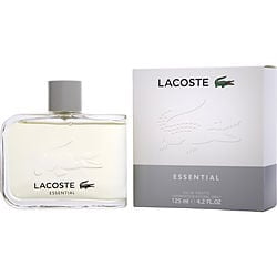 LACOSTE ESSENTIAL by Lacoste, EDT SPRAY 4.2 OZ in new packaging. The image shows a clear glass bottle with a silver cap, featuring the Lacoste logo and 'Essential' text. The box packaging is displayed beside the bottle, showcasing the brand name and signature crocodile logo.