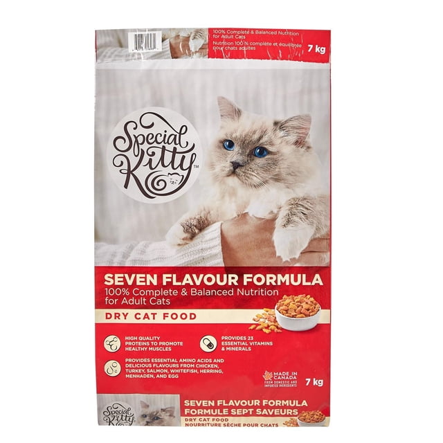 Special Kitty Seven Flavour Dry Cat Food 7 kg bag showing a cream-colored cat with blue eyes on the front. The packaging highlights a seven flavour formula with chicken, turkey, salmon, whitefish, herring, menhaden, and egg, providing 100% complete and balanced nutrition for adult cats. It includes high quality proteins, 23 essential vitamins and minerals, and is made in Canada from domestic and imported ingredients.