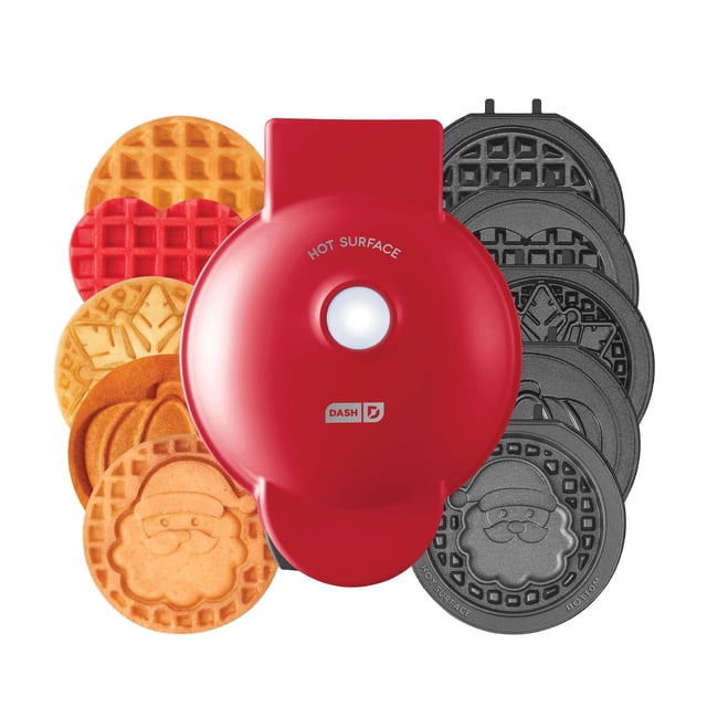 Dash Holiday Multimaker Mini System in red, featuring a compact waffle maker with six removable holiday-themed plates, including Santa, snowflake, pumpkin, heart, and classic waffle designs. The nonstick plates ensure easy food release and cleanup, and the system is ideal for festive family fun, holiday parties, and bake sales. Includes a recipe guide for creative seasonal treats.