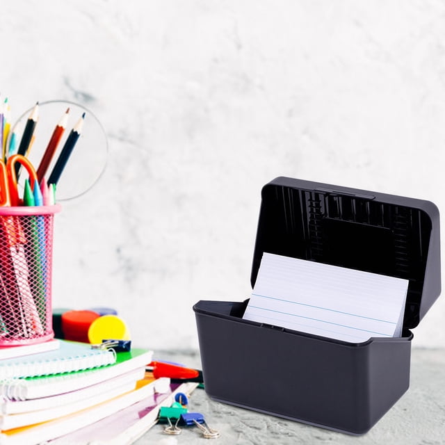 ZTTD Business Card Organizer, a black plastic index card holder with a snap closure lid, shown open and holding white index cards. Compact size with built-in ridges to keep cards secure and organized. Ideal for storing flashcards, recipes, or notecards, with a capacity of 300-400 cards. Suitable as a desk organizer, positioned on a desk next to colorful office supplies.