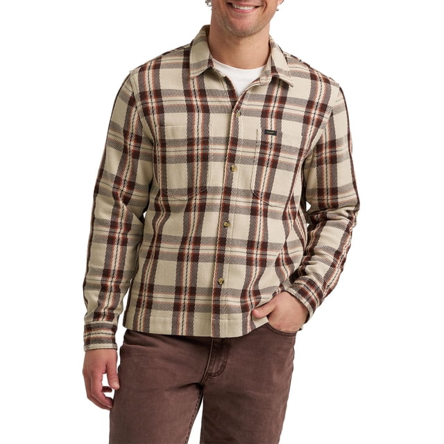 Lee® Men's Heritage Carolina Overshirt in beige with brown and red plaid pattern, featuring a relaxed fit, long sleeves with button cuffs, fold-down collar, front button closure, and chest pocket with Lee logo patch, worn over a white T-shirt and brown pants, ideal for layering through all seasons.