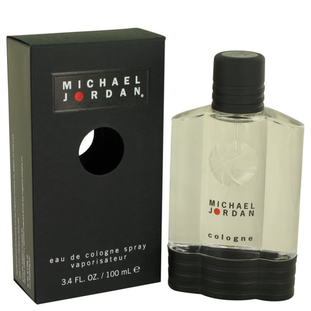 Michael Jordan Eau de Cologne Spray for Him 100ml, a men's cologne in a transparent bottle with a black cap and embossed basketball design. The packaging features a black box with bold branding and a cutout revealing the bottle. This refreshing, spicy fragrance blends cedar, sandalwood, green tea, and leather, ideal for daytime wear.