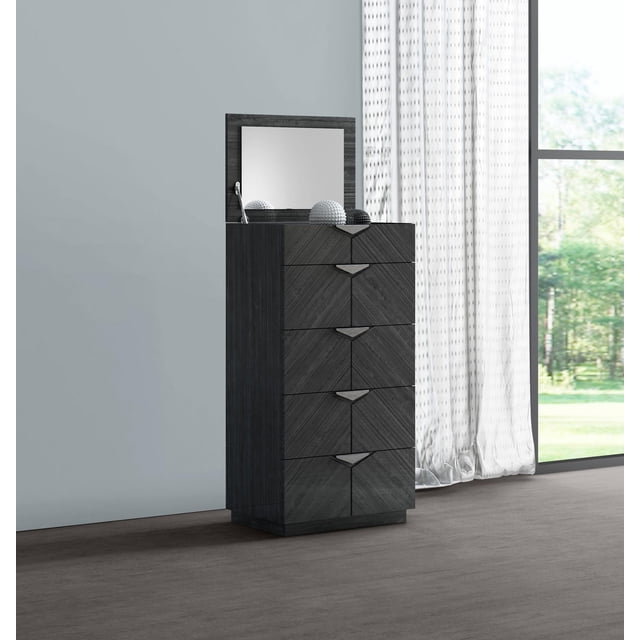 K-Living Stark Solid Wood Chest with Built in Mirror & Jewellery Storage in Angley Grey Finish, a tall chest with five drawers featuring chevron wood grain and metal handles, topped with a hinged mirror and decorative spheres, placed on a wood floor near sheer white curtains and a large window, ideal for bedroom storage and jewellery organization.