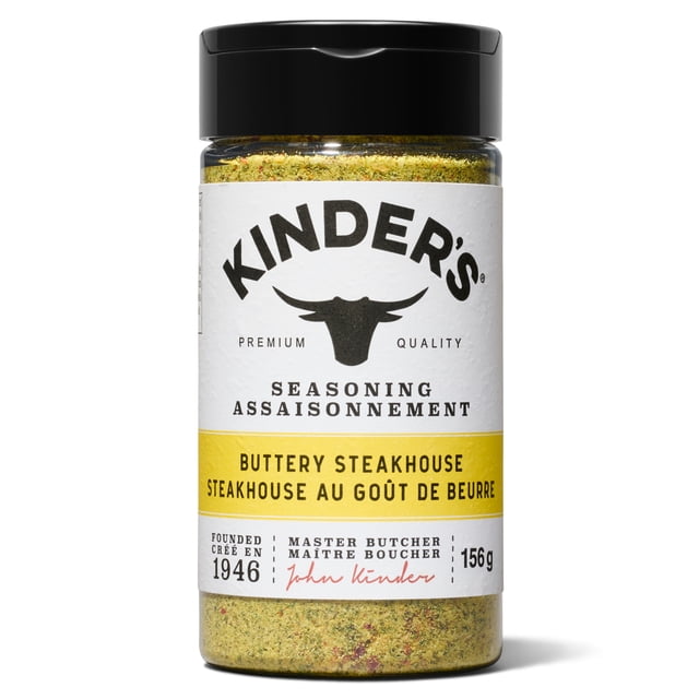 Kinder's Buttery Steakhouse Seasoning Spice 156g in a clear jar with a black flip-top lid, featuring a white label with the brand's bull head logo and bilingual English-French text, highlighted by a yellow band for buttery steakhouse flavour, ideal for seasoning meats, vegetables, and eggs.