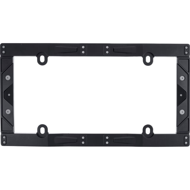 Cruiser Accessories Cadre de Plaque d'Immatriculation Industriel Noir Montré d'Une Vue de Haut en Bas. le Cadre Rectangulaire Est Fait de Métal Moulé sous Pression en zinc durable avec une Finition Texturée Noire Mate Revêtue de Poudre, Comprenant Quatre Trous de Montage et Quatre inserts en Plastique ABS Gris Canon. Conçu pour s'Adapter à Toutes les Plaques d'Immatriculation standard 6x12 Pouces, Il Offre une construction Robuste et Ultra-Résistante pour une Utilisation Extérieure Automobile et une installation Facile. Il Convient Aussi pour Afficher en Toute Sécurité des Pl