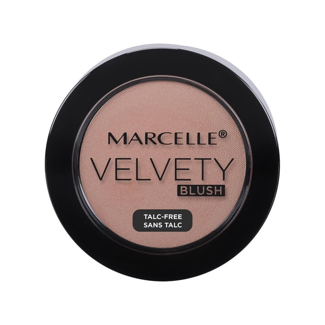 Marcelle Velvety Blush powder compact in a round black case with clear lid revealing soft pink blush, featuring superfine pigments, talc-free formula, vitamin E enrichment, and smooth velvety texture for natural finish and easy blending.