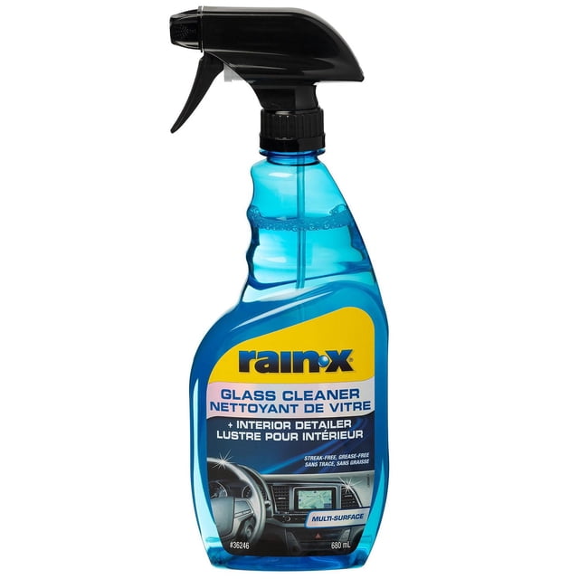 Rain-X Glass Cleaner & Interior Detailer 680 mL spray bottle with blue liquid and black trigger, formulated for streak-free cleaning of automotive glass, mirrors, plastic, leather, and electronic screens, ensuring clear visibility and interior surface care.