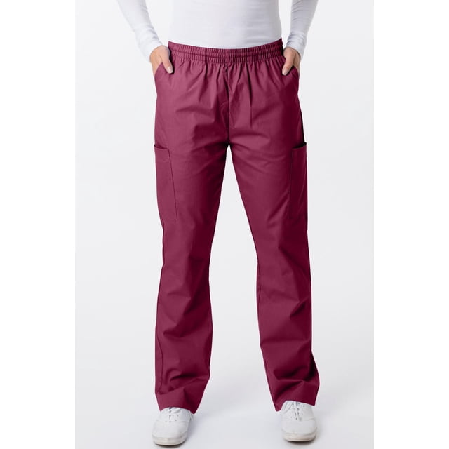 Greeentown Canada Classix Unisex Scrub Pant (2005) in burgundy with full elastic waistband and inner drawstring, two side slash pockets, and two cargo pockets on tapered legs, shown front-facing on a model wearing white sneakers and a white long-sleeve top against a white background.