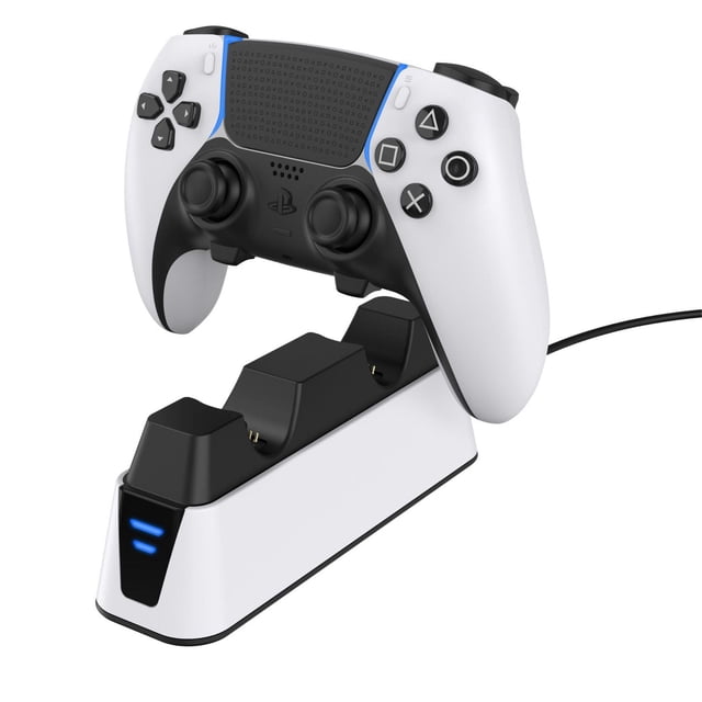 Surge Dual Charge Dock for PlayStation 5 DualSense & Edge Controllers front-facing dual controller charger with two upright DualSense controllers on metal contact pads, LED charge indicators on the front of a compact black base that organizes controllers. Often used as a display stand to keep controllers tidy.