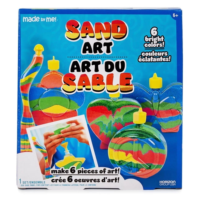 Made By Me Sand Art kit includes six clear plastic bottles in star, butterfly, flower, heart, peace sign, and squiggle shapes filled with layered red, green, yellow, and blue sand, with yellow caps and a funnel for precise pouring, ideal for creative art projects for ages 6 and up, shown on a blue background with bilingual text highlighting six bright colors.
