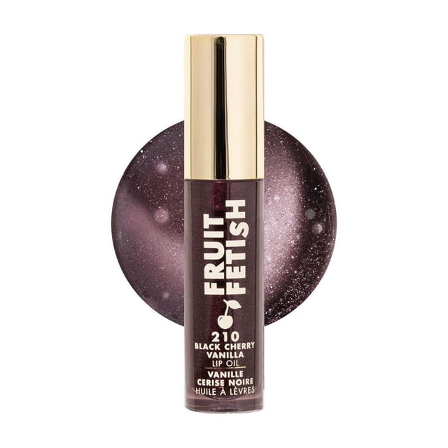 Milani Fruit Fetish Lip Oil 210 Black Cherry Vanilla, a nourishing lip oil with a glossy finish and subtle deep berry tint, in a clear tube with gold cap, shown with a circular swatch of the tinted oil behind it, suitable for hydrating and adding shine to lips.