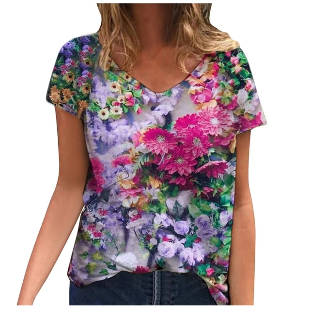 Plus Size Women Short Sleeve Printed V Neck Tops Tee T Shirt Blouse designed with a vibrant floral pattern in pink, purple, and green hues. This women's plus size blouse features a relaxed fit, short sleeves, and a V-neck, crafted from lightweight polyester. Ideal for casual summer wear.
