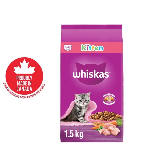 WHISKAS Dry Kitten Food Chicken for cats 1-12 months in a 1.5 kg purple bag featuring a gray tabby kitten on a pink blanket, a bowl of crunchy kibble with soft meaty centers, chicken pieces, carrots, and peas, proudly made in Canada.