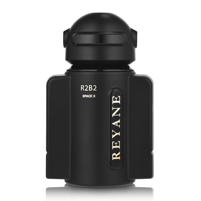 Reyane Tradition R2B2 SPACE X Parfum Édition Limitée pour Hommes, une Eau de Parfum Présentée dans une Bouteille en Verre Élégante Inspirée d'Un Astronaute Noir avec un Lettrage Doré Audacieux. le Parfum Offre des notes de Tête de Bergamote, d'Agrumes, de Mandarine et de Pomme, des notes de Milieu de Baie de rose, de Coriandre, de Poivre Noir, de patchouli et de Bois Blanc, et des notes de base de Musc, d'Ambre et de tonka. Livré en format Applicateur en Vaporisateur de 3,3 fl oz