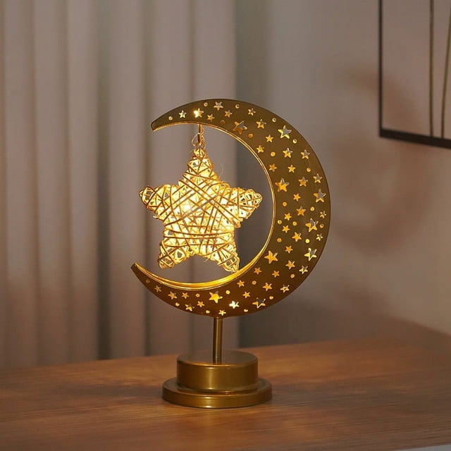 EGNMCR Night Lights LED Decorative Light with a star-shaped design suspended within a crescent moon frame made of wrought iron. The warm LED glow provides gentle lighting, ideal for nighttime use, soothing children, or as a decorative accent. Energy-saving LED technology ensures long-lasting performance. Perfect for indoor lighting accessories, it can be placed on tables or shelves to enhance home decor.