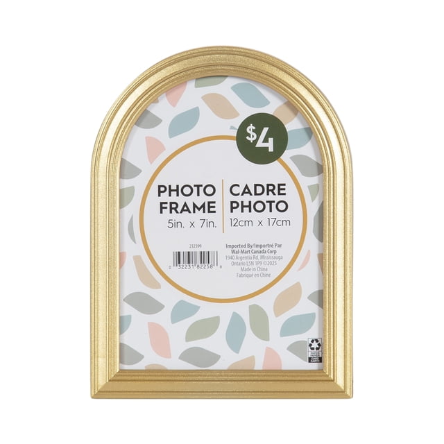 DesignOvation Maynor Arch 5x7 Gold Picture Frame with a vintage arch shape and stepped profile design in gold finish. This decorative tabletop frame holds a 5 by 7 inch photo and includes an attached easel for desk or mantel display and a wall hanger for gallery mounting. It is suitable for creating personalized photo displays or gifting cherished memories.