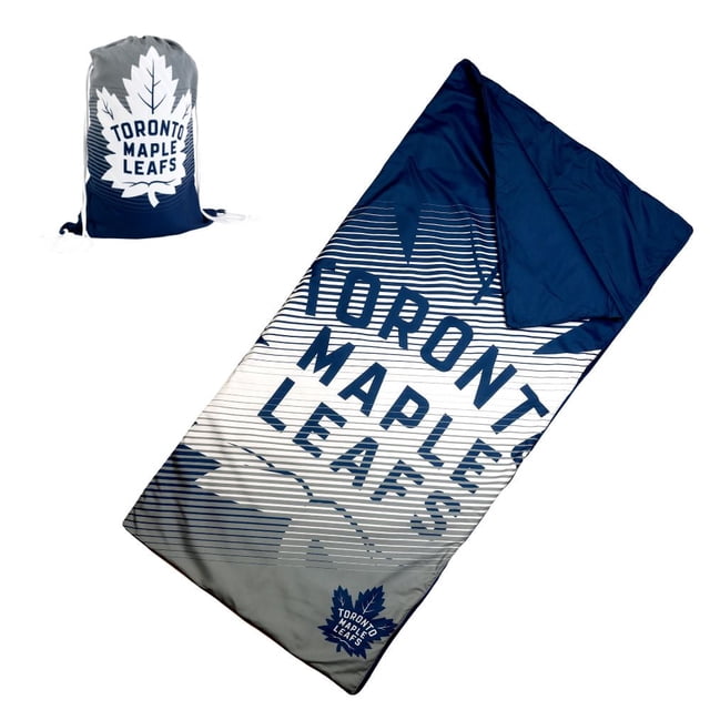 LNH Maple Leafs de Toronto Sac de Sommeil Intérieur Léger en Microfibre de polyester Douce avec Motif Réversible Bleu Marine et Blanc Mettant en Vedette le Nom de l'Équipe et le logo, Comprend un Sac compact à Cordon pour des Déplacements Faciles, Convient aux Soirées Pyjama pour Enfants et à l'Utilisation Intérieure.