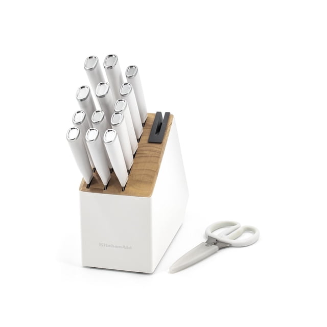 KitchenAid 15 piece Cutlery Set with white textured handles and silver caps in a two-tone wood and white knife block with built-in sharpener, plus white-handled universal shears with blade cover, suitable for precise kitchen cutting and everyday culinary use.