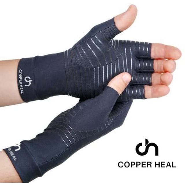 COPPER HEAL Arthritis Compression Gloves designed for rheumatoid arthritis, carpal tunnel, RSI, osteoarthritis, and tendonitis. These fingerless gloves are made of 88% copper nylon and 12% spandex, providing mild compression to alleviate muscle stiffness, soreness, and pain. The gloves feature a dark colour with visible stitching and a Copper Heal logo on the wrist area.
