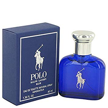 Polo Blue By Ralph Lauren Eau De Toilette Spray 1.4 oz. The image shows a cobalt blue glass bottle with a silver cap, featuring the iconic Ralph Lauren polo player logo in white. The bottle is accompanied by a matching blue box with white accents and branding. This fragrance includes notes of melon, cucumber, tangerine, sage, geranium, basil, suede, moss, amber wood, patchouli, and musk.