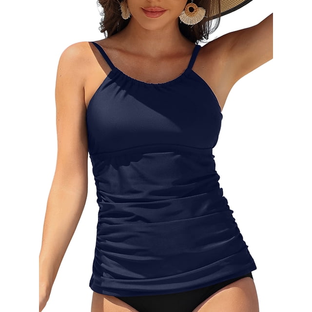 Charmo Women's High Neck Tankini Tops Only Tummy Control Swimsuit Top Ruched Swim Top Without Bottoms. This navy blue tankini top features a high neckline, ruched detailing for a slimming effect, and adjustable shoulder straps. Designed with a padded push-up bra for support and an open back for a flirty yet modest look. Made from 82% polyester and 18% spandex, it offers UPF 50+ sun protection and quick-dry properties. Suitable for pairing with various swim bottoms.