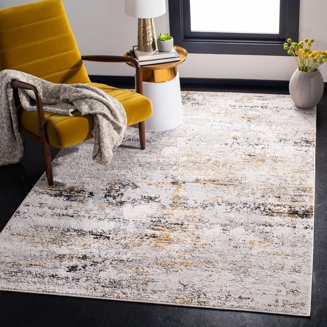 SAFAVIEH Amalfi Cian Abstract Distressed Area Rug with tonal beige, black, and gold abstract patterns and raised textures on a dark floor. Shown with a mustard yellow mid-century modern armchair draped with a grey throw, a white and gold side table with a lamp and plant, and a grey vase with yellow flowers by a window, ideal for contemporary accent spaces.