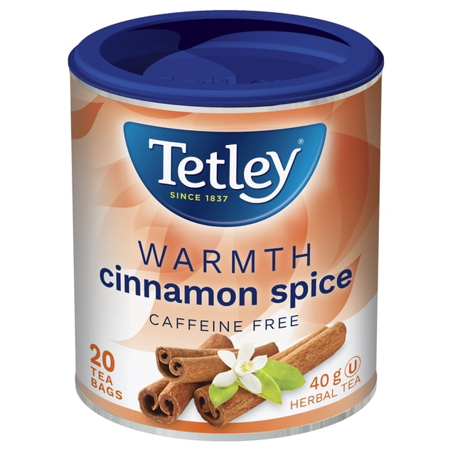 Tetley Warmth Tea cinnamon spice herbal tea container with 20 tea bags and 40 g weight, featuring a blue lid and label showing cinnamon sticks and a white flower, caffeine free aromatic infusion with warm, spicy hints ideal for cozy moments.