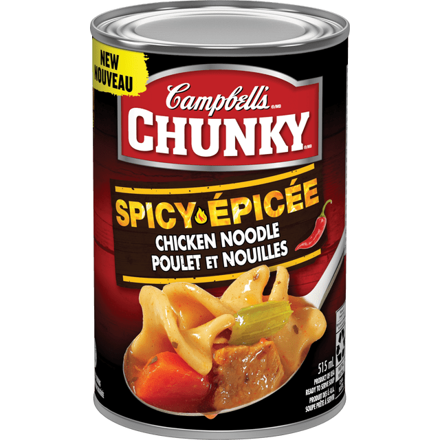 Campbell's® Chunky® Spicy Chicken Noodle Soup, Shelf Stable can with a front label in red and black, showing bold white and yellow text, a red chili pepper icon, and a close-up of chunky chicken, twisted noodles, carrot, and celery in a spicy broth on a spoon, 515 ml, suitable for pantry food and canned chicken soup.
