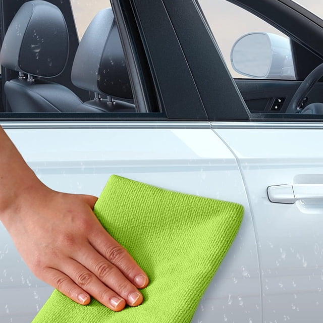 Thickened Microfiber Cleaning Cloths, a 7-pack of multipurpose rags, shown in use wiping the exterior of a car. A green, solid-color cloth is being held by a hand, demonstrating its super absorbent and quick-dry properties. Ideal for kitchen, household cleaning, dishes, and car washing.