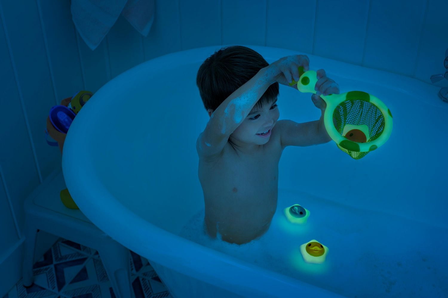 Munchkin Catch a Glowing Star™ Glow in the Dark Jouet de bain pour bébé