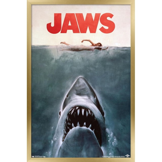 Jaws - One Sheet Wall Poster, 22.375" x 34" showing a centered front view of a great white shark with open jaws and sharp teeth swimming upward beneath a woman swimming on the water surface, with bold red JAWS text at the top, printed on glossy poster paper ideal for wall art and home décor.