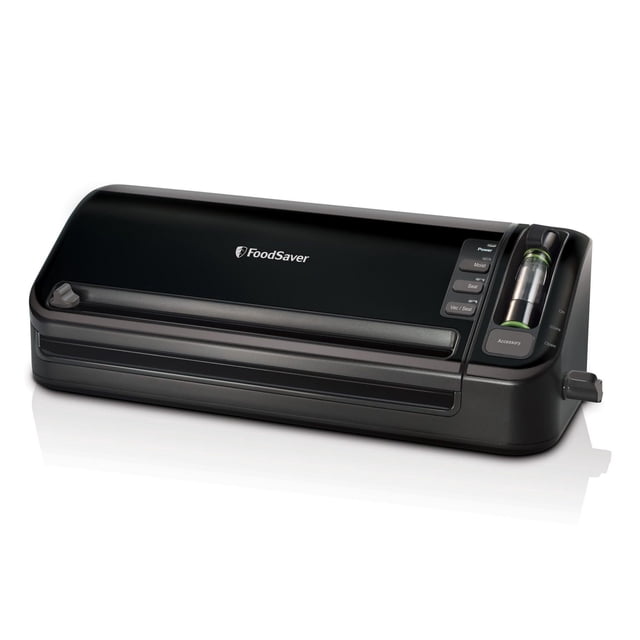 FoodSaver FM3600 2-In-1 Manual Operation Food Preservation System in black with front-facing control panel featuring power, moist, seal, and vac/seal buttons, built-in roll storage with cutter, and manual crank, designed for vacuum sealing bags and containers to extend food freshness and reduce waste, also suitable for sealing marinades and pantry items.