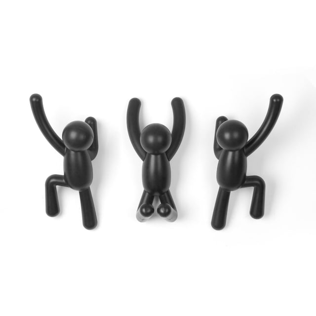 Umbra Buddy Wall Hooks set of three black matte wall hooks shaped like climbing human figures with arms and legs extended in various positions for hanging coats, bags, or accessories, ideal for entryway or bedroom organization and decorative storage.
