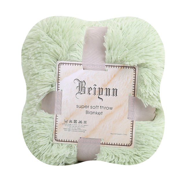 Soft Warm Shaggy Faux Throw Blanket Sofa Double Bed Blanket in a light green color, made from 100% microfiber polyester. The blanket features a super soft, double-sided fluffy texture, ideal for adding warmth and comfort to sofas, beds, or cars. It is shown neatly folded with a decorative label and secured with ribbon ties.