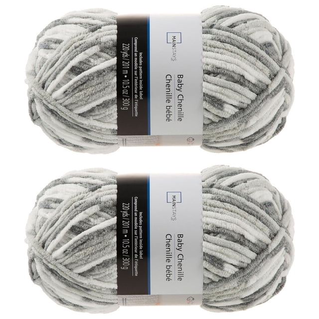 MAINSTAYS COZY CHENILLE 2 PACK BABY GRAYS YARN with two skeins of soft grey and white baby chenille yarn, each containing 220 yards (201 meters) and weighing 10.5 ounces (300 grams), ideal for knitting or crocheting cozy items for infants and toddlers.
