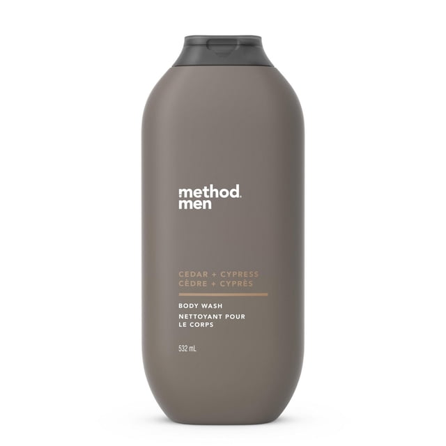 Method Men's Body Wash Cedar + Cypress, 532 ml, in a matte taupe bottle with a black flip-top cap, labeled with white and light brown text. This plant-based body wash lathers quickly, rinses clean, and is free of parabens and phthalates, ideal for bath and shower use with a woodsy cedar and cypress scent.