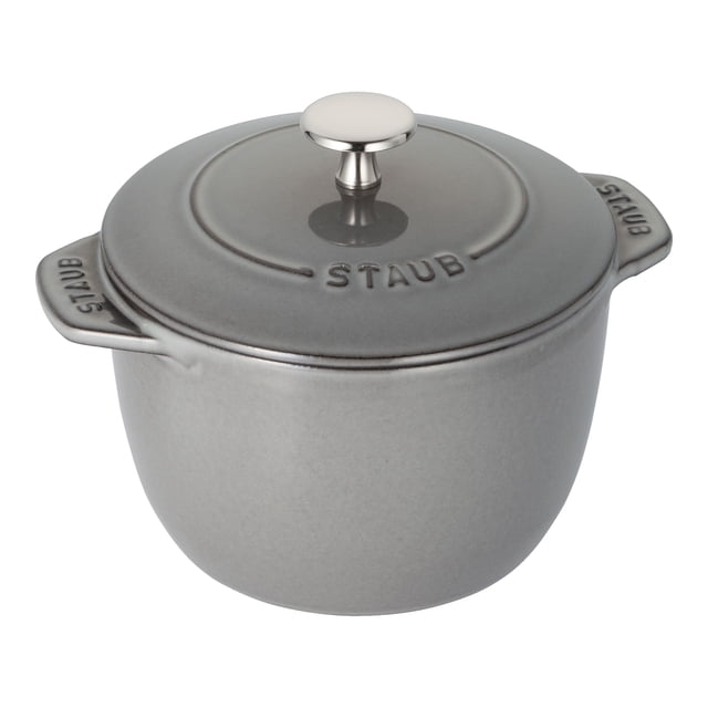 STAUB La Cocotte 1.75 L Cast Iron Round Rice Cocotte in graphite-grey. This compact French oven features a Chistera drop-structure lid for continuous condensation, ensuring fluffy rice and tender grains. Made in France, it has a heavy, tight-fitting lid with moisture-retaining spikes, a nickel steel knob, and a smooth enamel bottom compatible with all stovetops, including induction. Oven safe up to 900°F without the lid and 500°F with the lid. Dishwasher safe, though hand washing is recommended.