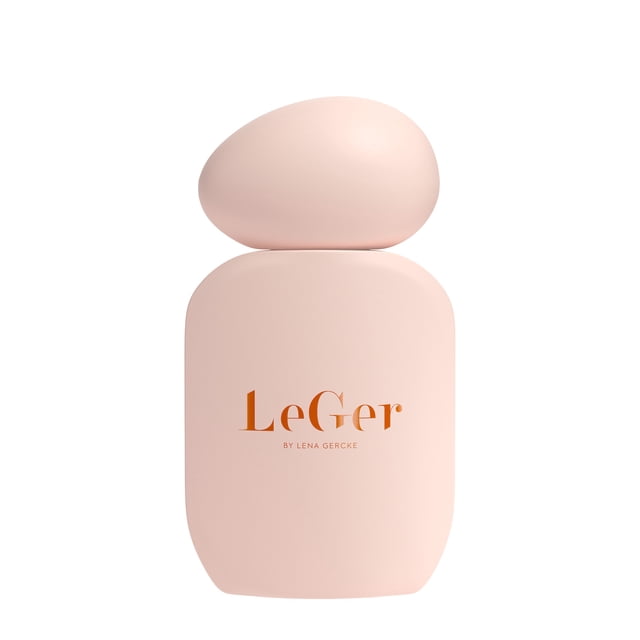 LeGer Signature Eau de Parfum 30 ML bottle in soft peach with a smooth, rounded rectangular shape and asymmetrical oval cap, featuring copper lettering. This sensual ambery gourmand perfume for women blends bitter-sweet almond, cedarwood, and musk notes.