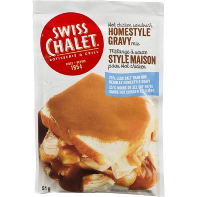 Swiss Chalet Hot Chicken Sandwich Homestyle Gravy Mix less salt 51g pouch showing a close-up of a hot chicken sandwich with thick brown homestyle gravy over white bread and chicken, offering 25% less salt than regular gravy and suitable for enhancing poultry dishes.
