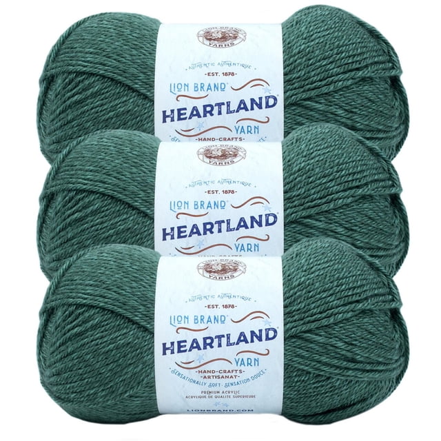 Lion Brand Yarn Heartland Yarn 3Pack with three skeins of medium worsted weight acrylic yarn in a heathered green colour, each wrapped in a white label featuring the brand and product name, suitable for knitting, crochet, and home décor projects.