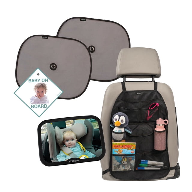Ezi Travel Pack essential car accessories for baby including two grey sun visors with suction cups, a black XL car seat organizer attached to a beige car seat back holding a penguin toy, water bottle, and markers, a baby on board sign, and a 360° adjustable car mirror showing a child in a car seat.