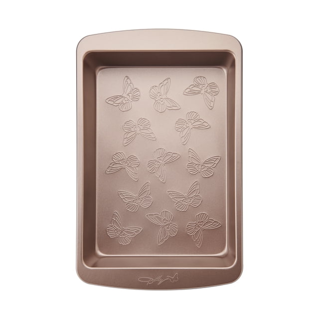 Dolly Parton 9x13" 05mm Non Stick Cake Pan front-facing rectangular 9"×13"×2" heavy-duty carbon steel bake pan with an embossed textured butterfly design on the cooking surface, non-stick rolled rim to prevent warping and oven-safe to 450°F/232°C. Often used as a serving tray for sheet cakes or chilled desserts.