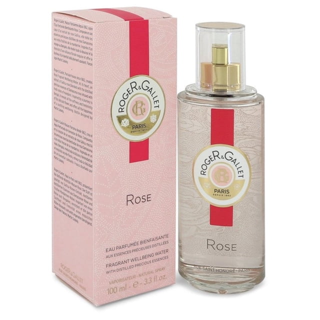 Rose by Roger & Gallet 3.3 oz Gentle Fragrant Water Spray, featuring a transparent bottle with a gold spray nozzle and a pink label, displayed alongside its matching pink box with floral patterns and branding.